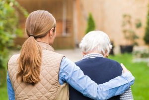 Daughter and elderly mom walking